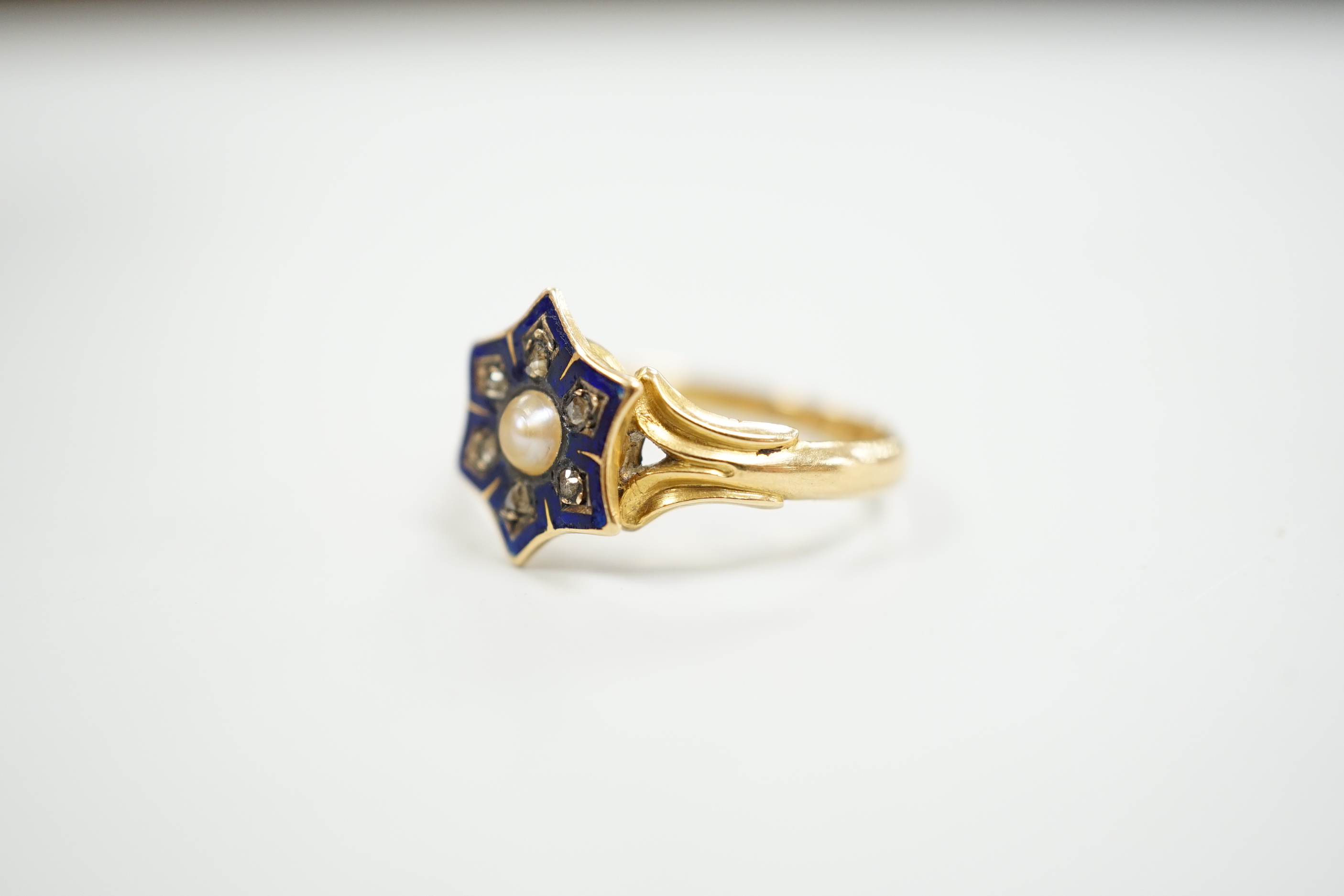 A Victorian 18ct gold, enamel, rose cut diamonds and split pearl set ring, size L, gross weight 2.9 grams.